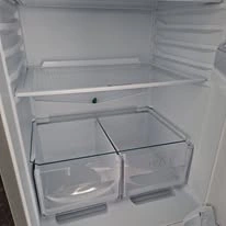 After cleaning: refrigerator interior left clean and refreshed