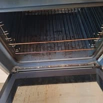 Before cleaning: oven interior with baked-on grease and residue