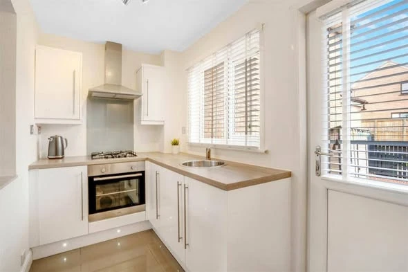 Bright white kitchen after professional cleaning